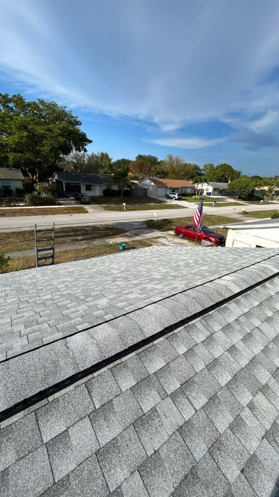 roofers working on a shingle roof